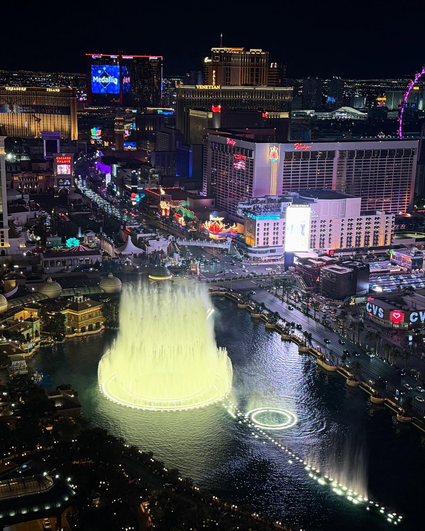 Nighttime view of the Bellagio fountains and Las Vegas Strip from the Cosmopolitan