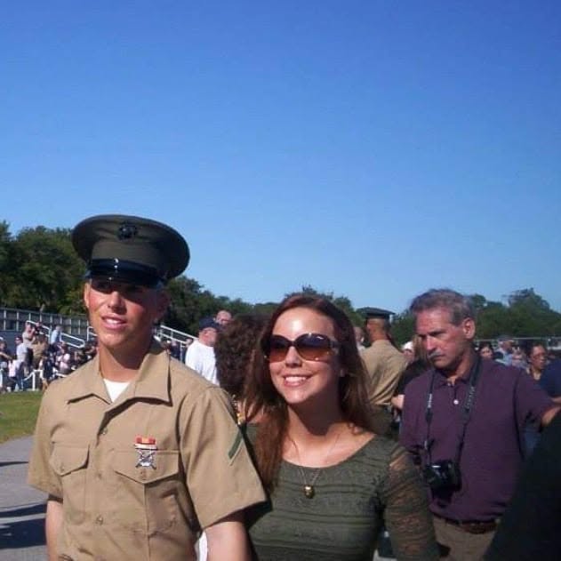 Devyn Harrington with Rachel after graduating from Marine Corps recruit training at Parris Island, with his Papa standing behind them