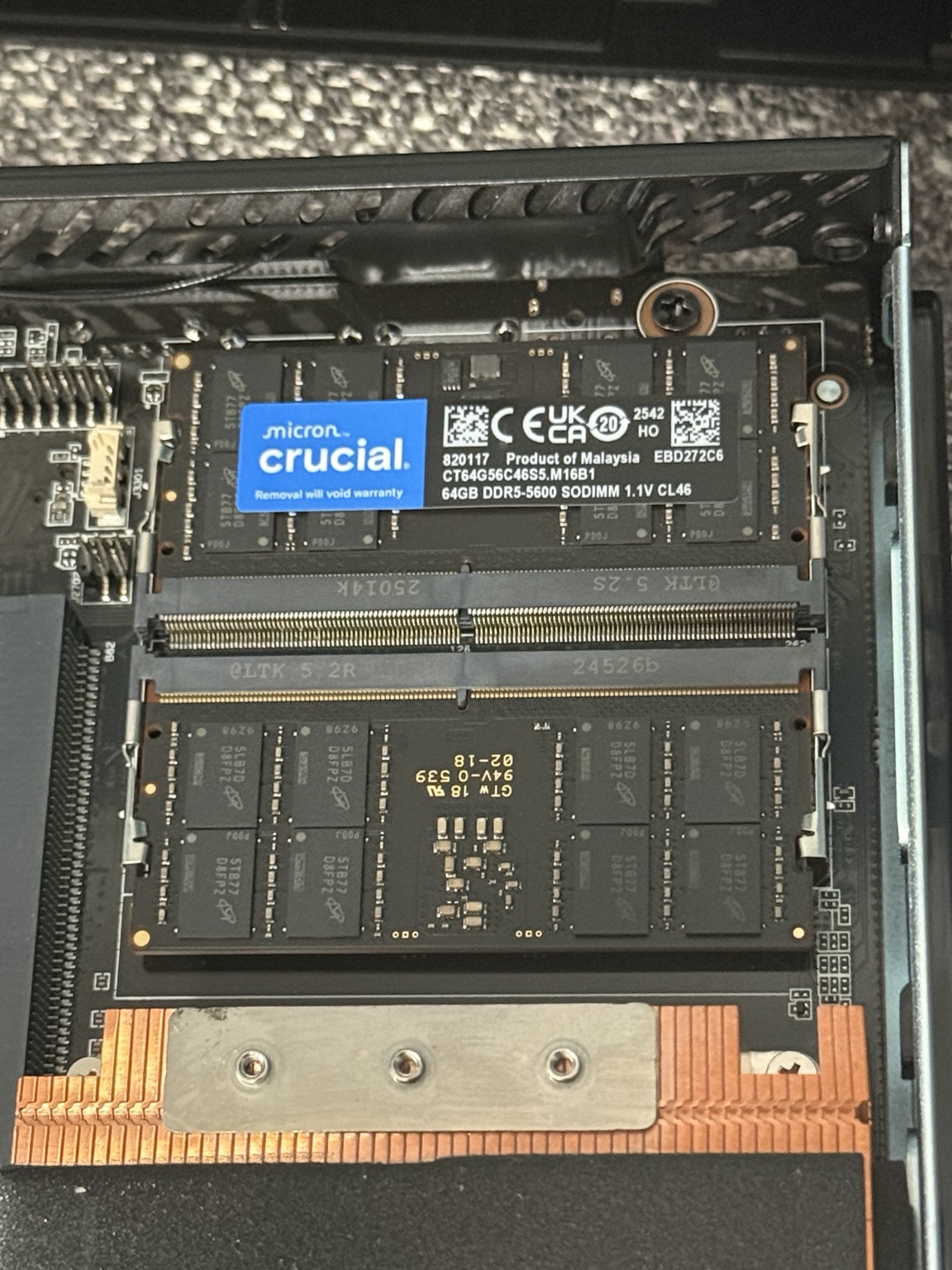 Two 64 GB Crucial DDR5-5600 SODIMMs installed in the MINISFORUM MS-A2